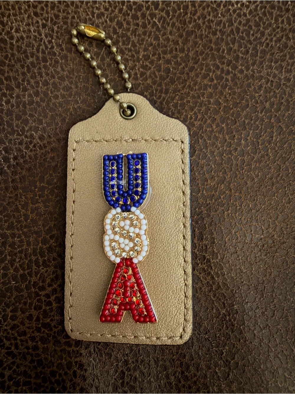 Coach Gold Leather Bag Tag with Red, White & Blue Beaded USA Accent